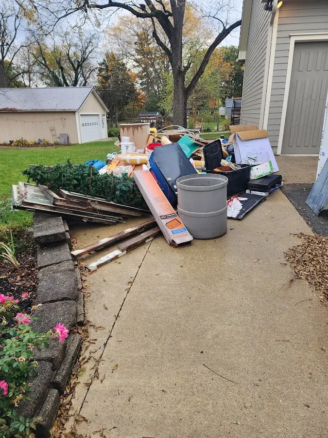 Dumpster being loaded with debris for Commercial Dumpster Rental in Middle Smithfield